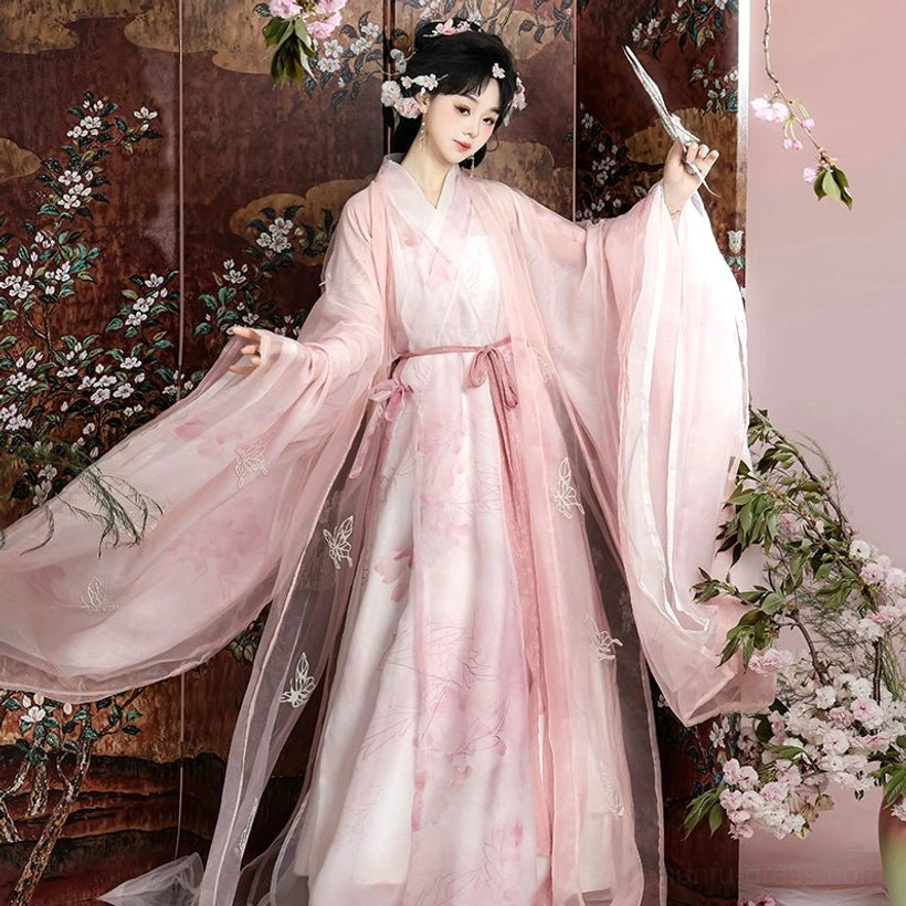 Pink butterfly Hanfu complete robe set in a front three-quarter pose, featuring gradient sheer fabric, wide sleeves, embroidered floral details, and tied sash