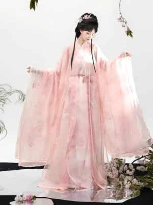 Front view of pink butterfly Hanfu robe complete set with translucent outer layer, oversized flowing sleeves, cross-collar design, and tied waist belt