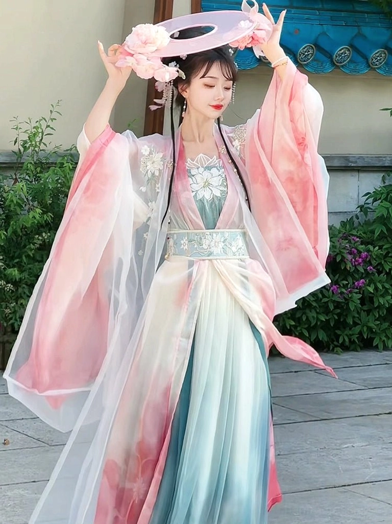 Front view of pink and cyan gradient Qiyao Ruqun Hanfu with sheer pink sleeves embroidered chest detail and traditional styling