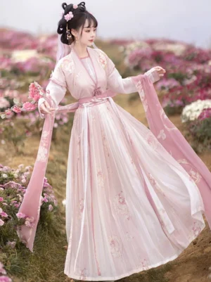 Three quarter side view of a romantic pink Tang Dynasty Hanfu dress with high waisted Qiyao Ruqun skirt, floral print, fitted waist sash, and flowing decorative scarves