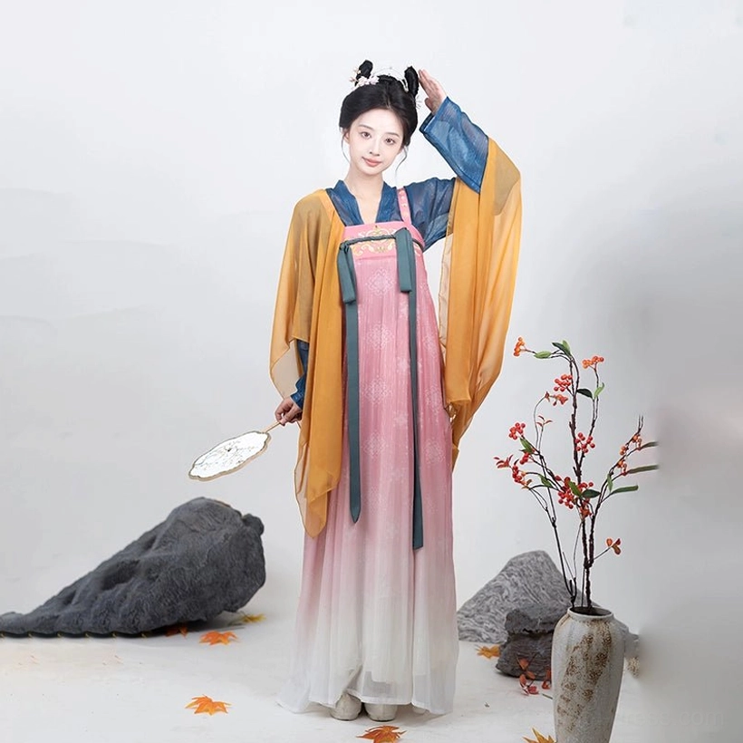 Front view of pink and ivory gradient Tang Dynasty Qixiong Ruqun Hanfu with green ribbons and yellow translucent shawl