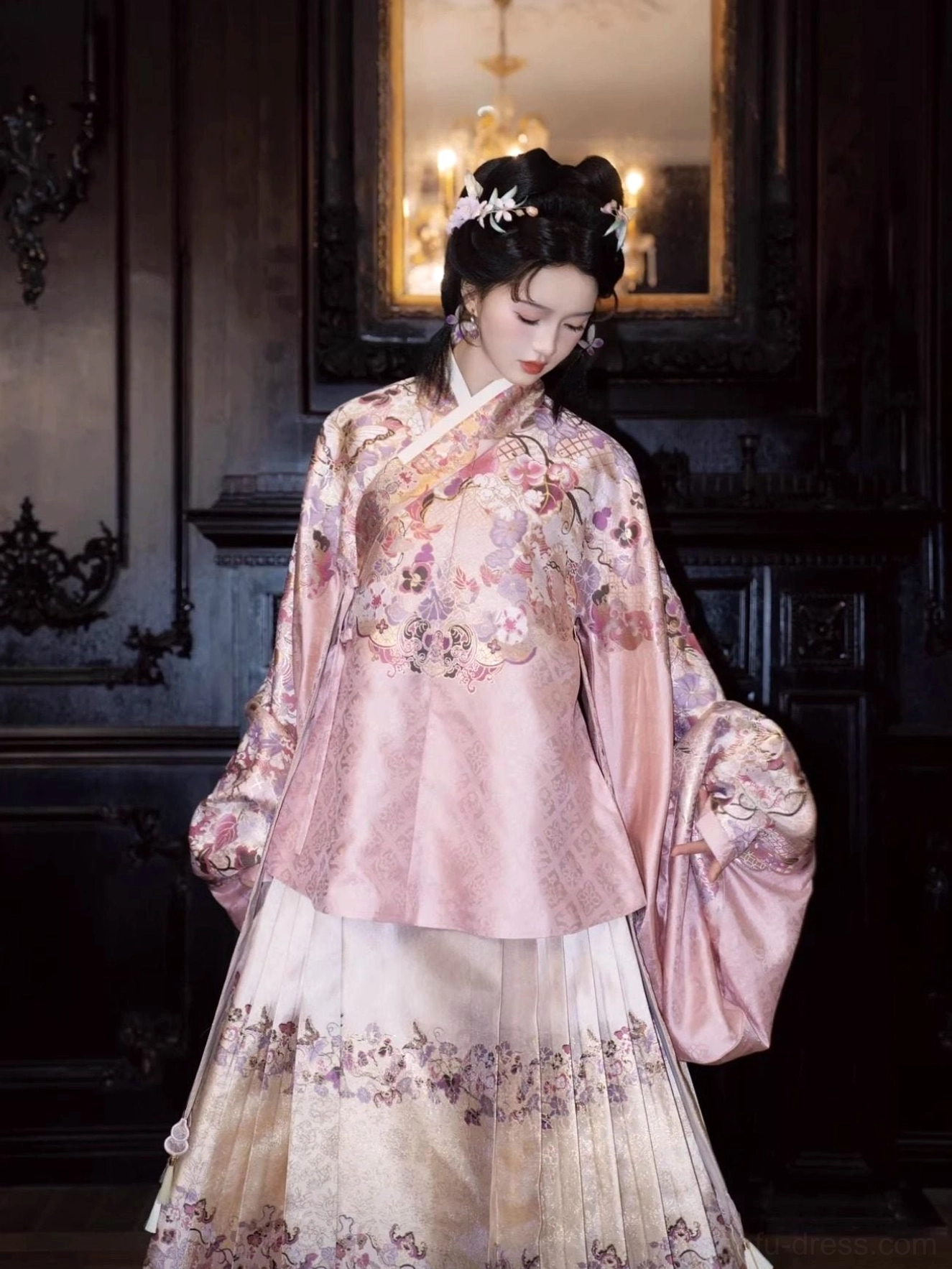 Close front view of a pink embroidered Ming Dynasty hanfu top with wide sleeves and matching floral mamian skirt