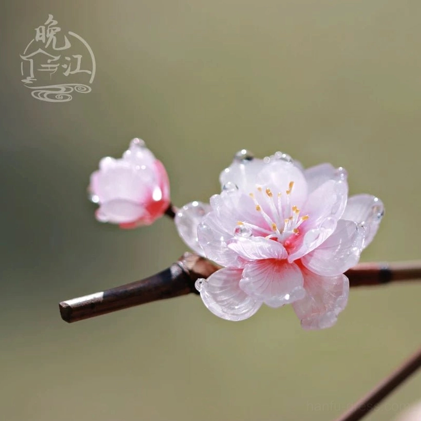 Close-up side view of a pink plum blossom Hanfu hair stick with a full flower matching bud dewdrop details and wooden stem