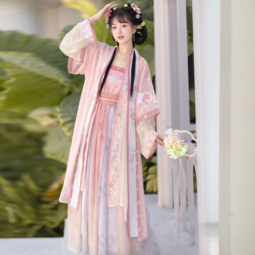 Pink Song Dynasty Qiyao Ruqun Hanfu model posing with a decorative flower prop, featuring an embroidered outer coat, long flowing ribbons, and layered gradient skirt