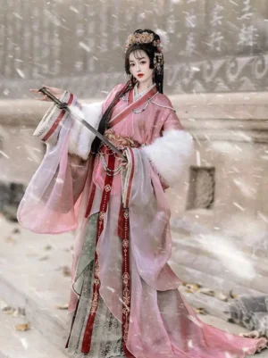 Pink Warring States Han Dynasty Hanfu robe set with sheer outer layer, white faux-fur sleeves, red front trim, embroidered floor-length skirt, and traditional sword styling