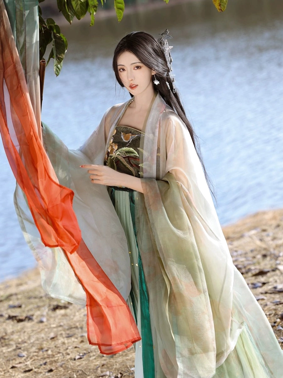 Pipa Beauty Tang style Hanfu dress with embroidered floral tube top, high-waisted green skirt, sheer pale green sleeves, and red styling scarf