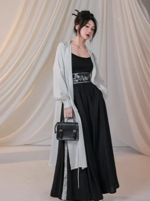 New Chinese style white sheer embroidered robe with flowing black wide-leg pants three-quarter front view