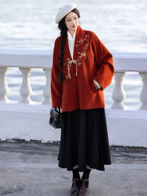 Front view of Plum Fragrance Song Dynasty Hanfu with embroidered rust red jacket, white inner top and black skirt by riverside