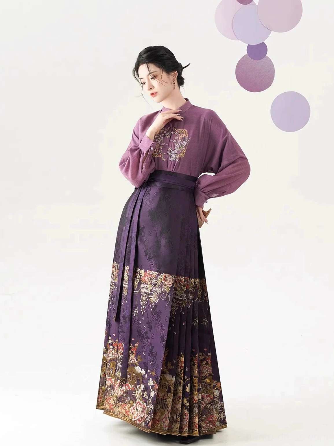 Dusty purple stand-collar Hanfu blouse with lantern sleeves and dark purple floral mamian skirt shown in a front three-quarter pose