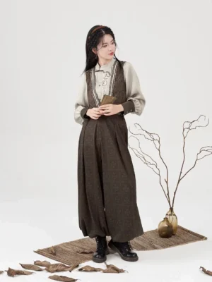 Full-body front view of the Poetry of the Wilderness modern Hanfu three-piece outfit with embroidered brown vest, cream blouse, and lantern pants