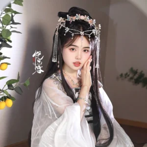 Pond Fairy Hanfu hair accessory worn with white flowing Hanfu, featuring a gold-tone floral crown, forehead tassel chain, and long pearl drop ornaments