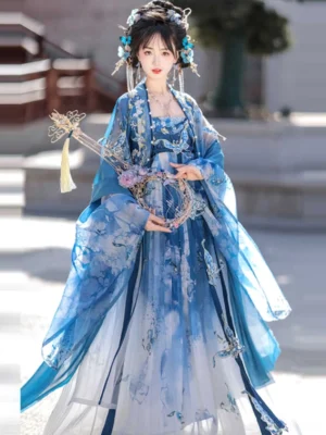 Front view of a blue and white Tang Dynasty Hanfu heziqun dress with ink-wash floral patterns, fitted bodice, oversized sleeves, traditional hair accessories, and ancient architecture