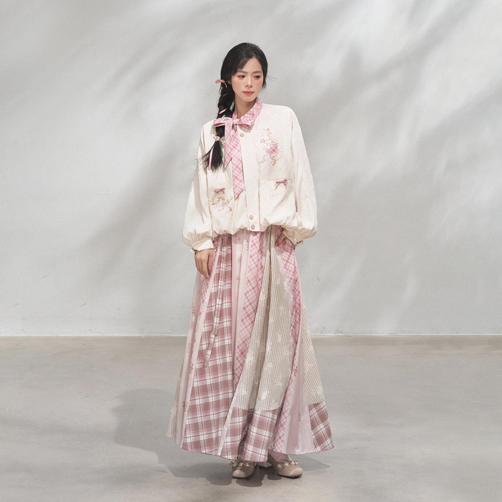 Full-body model wearing the complete powder pink modern Hanfu xianxia coat and skirt set with a soft sweet fairy-inspired traditional Chinese fashion aesthetic