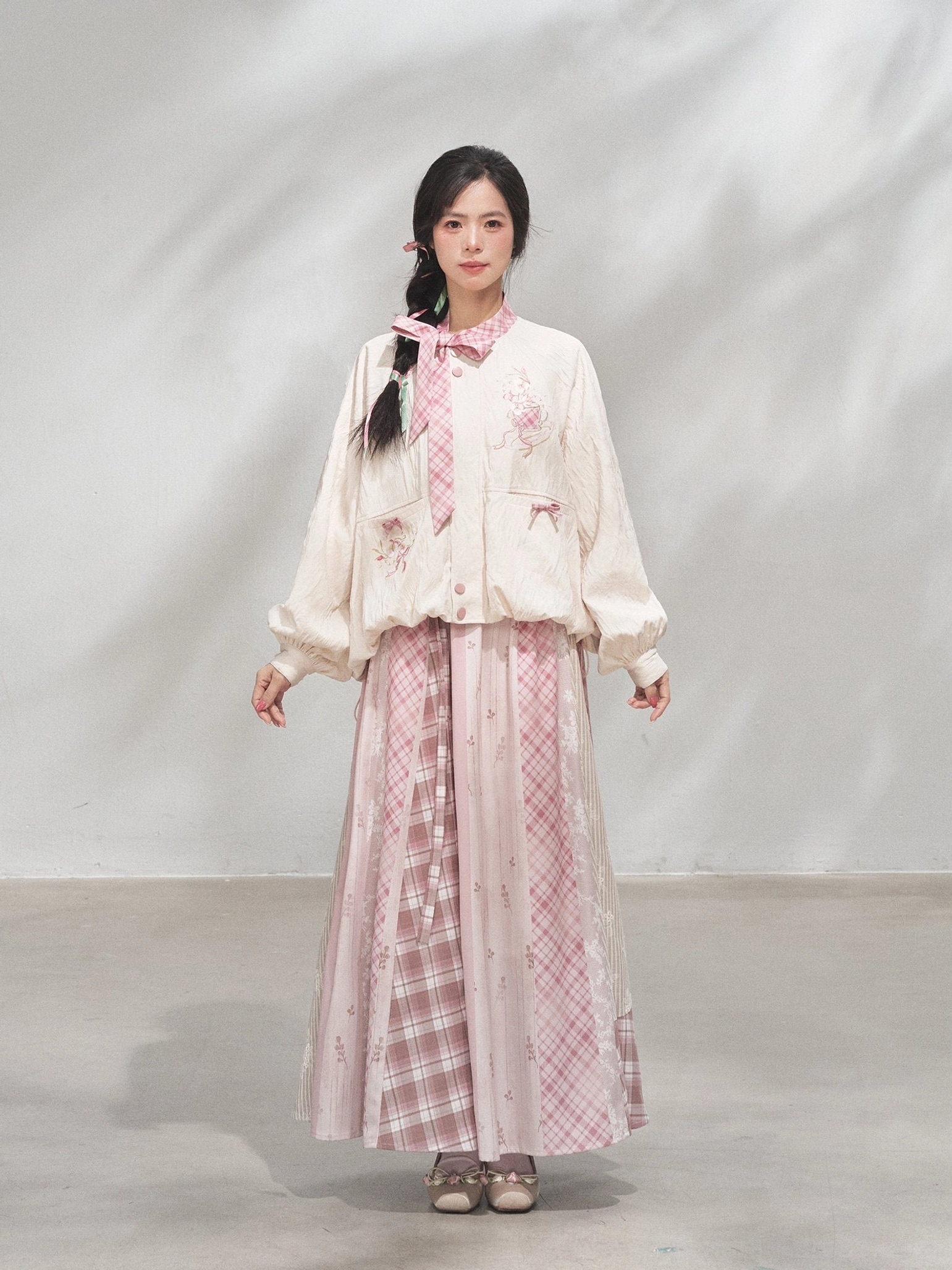 Front view of the full modern Hanfu xianxia outfit with delicate floral embroidery on the cream coat and a high-waisted flowing skirt