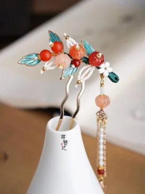 Pair of pumpkin tassel hairpins with pink orange pumpkin beads blue cloisonne style leaves red agate accents white pearl clusters and long beaded tassels for Hanfu hairstyles