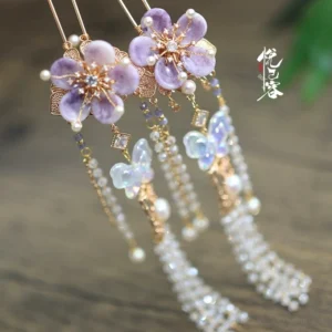 Purple Chinese flower tassel hairpin with gold-tone metal frame, pearl dangling tassel, iridescent butterfly charm, and traditional hanfu hair accessory details