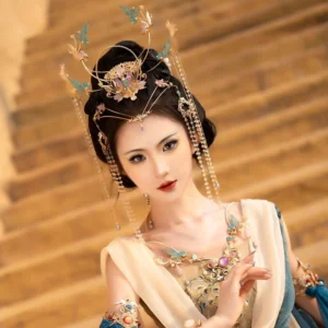 Purple Dunhuang Hanfu fairy hair accessory complete set worn with a traditional flying dance costume, featuring a gold-tone crown, blue phoenix motifs, purple gemstones, and long crystal tassels