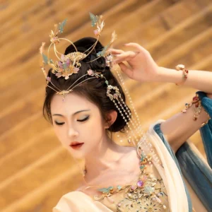 Side view of a purple Dunhuang Hanfu hair crown set with layered floral and bird ornaments, pearl-style beads, crystal tassels, and matching traditional dance styling