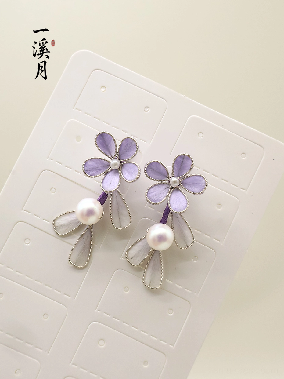 Purple floral Hanfu earrings with glossy white pearl centers and silver trimmed translucent petal pendants displayed on an earring card