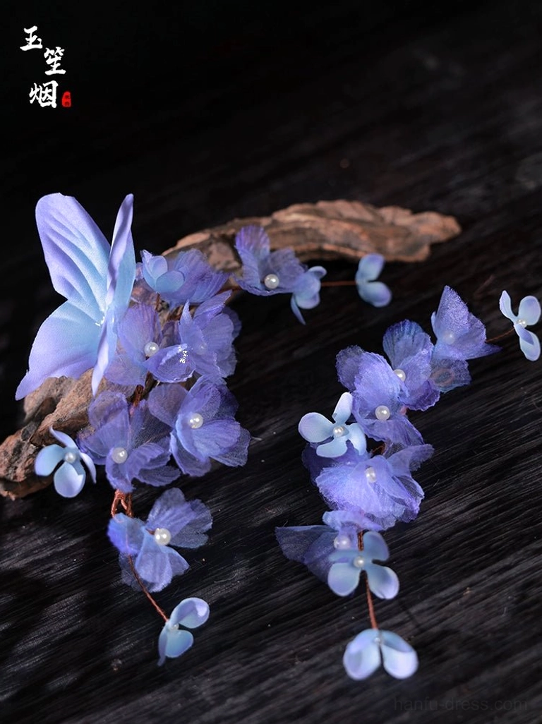 Long purple flower and blue purple butterfly Hanfu hair accessories with pearl-like flower centers on dark wood background