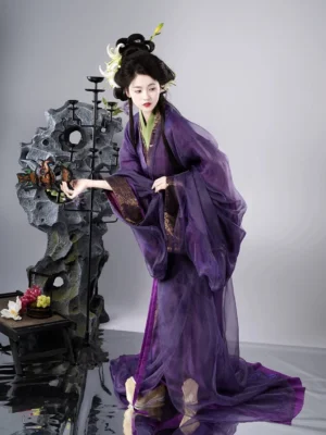 Purple Han Dynasty Hanfu robe shown from the side with a flowing sheer outer layer, wide sleeves, gold cuff trim, waist sash, and dramatic floor-length train