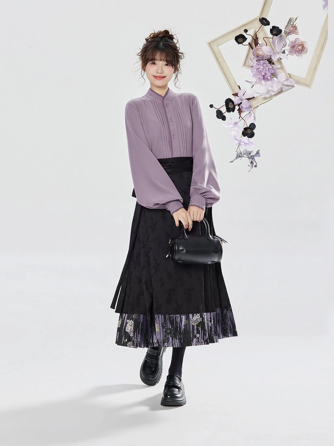Front view of a purple traditional-inspired hanfu shirt paired with a black pleated mamianqun horse-face skirt with subtle floral texture