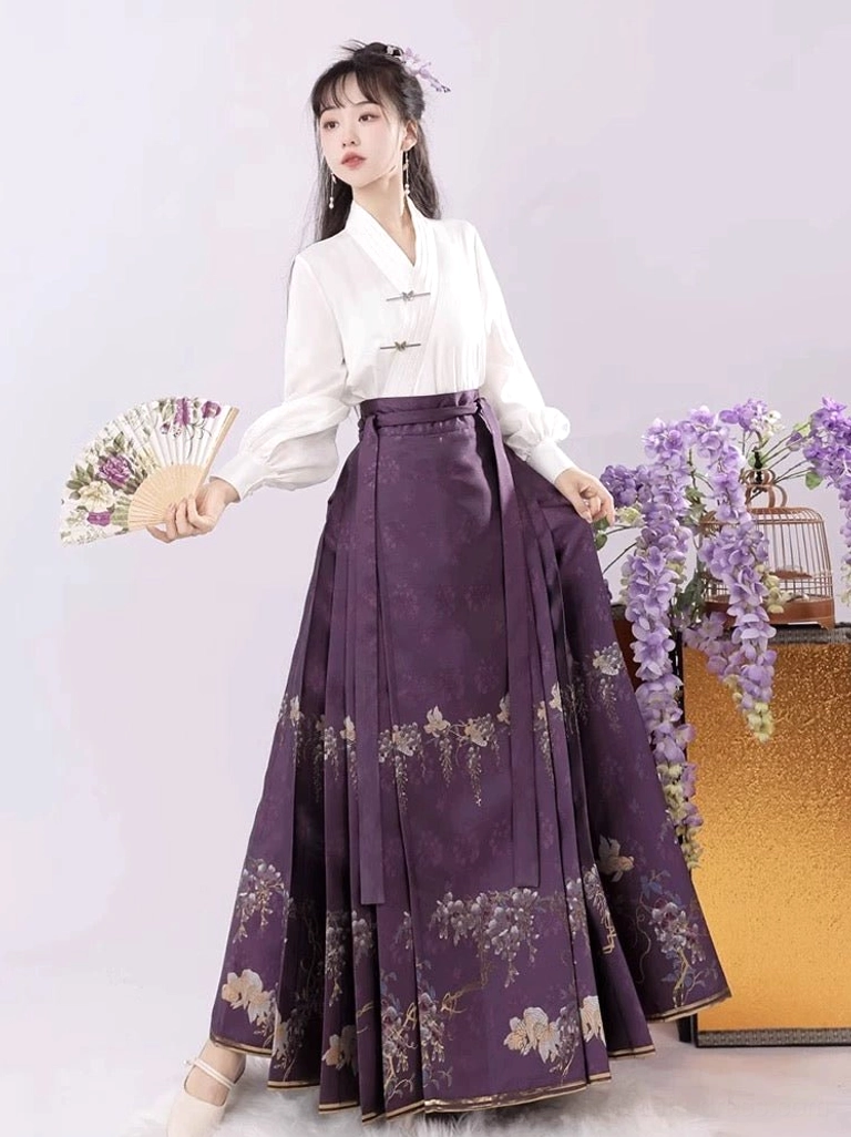 Elegant purple mamianqun Hanfu outfit with golden wisteria and floral motifs, classic pleated horse face skirt, white cross-collar top, and folding fan