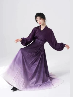 Side view of purple Ming-style Hanfu two-piece set with cross-collar winged sleeve top and high-waisted pleated mamian skirt