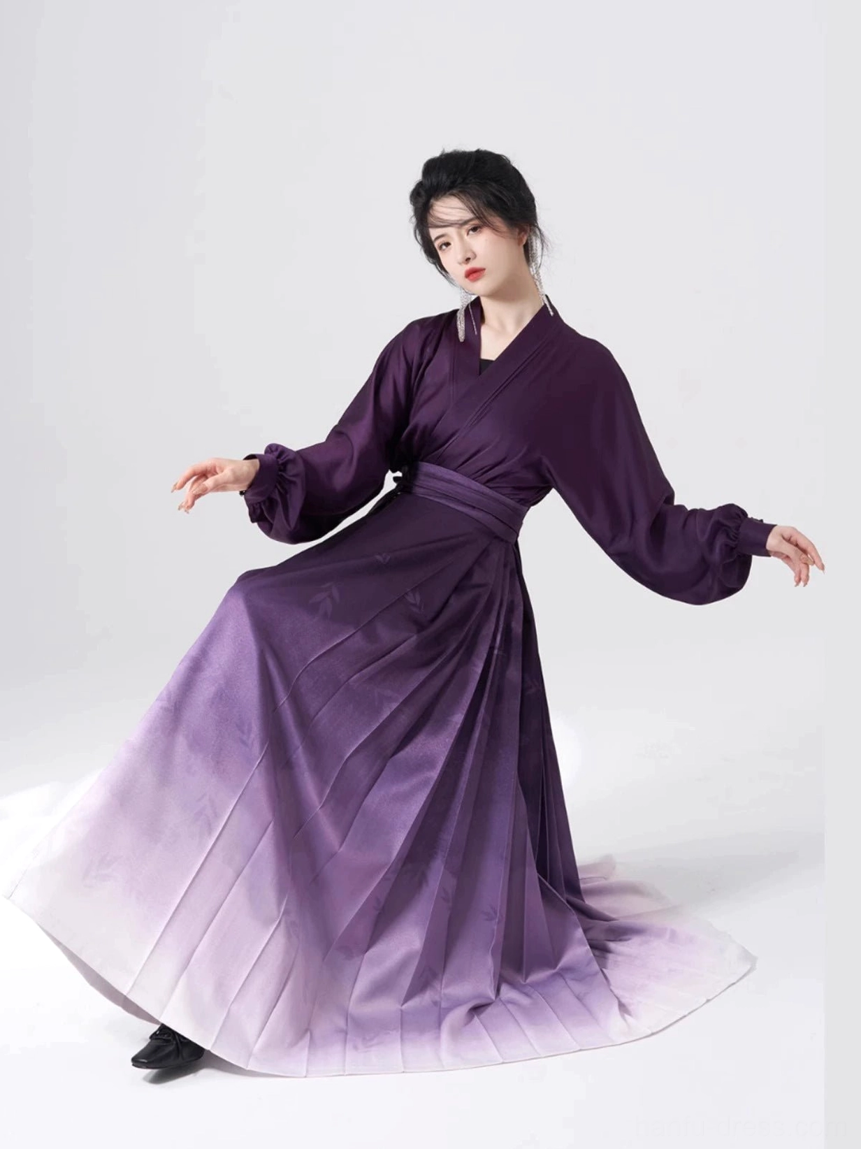 Side view of purple Ming-style Hanfu two-piece set with cross-collar winged sleeve top and high-waisted pleated mamian skirt