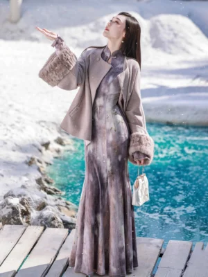 Modern Chinese style purple mermaid cheongsam with taupe cropped jacket and fuzzy fur-trimmed sleeves shown in a snowy outdoor setting