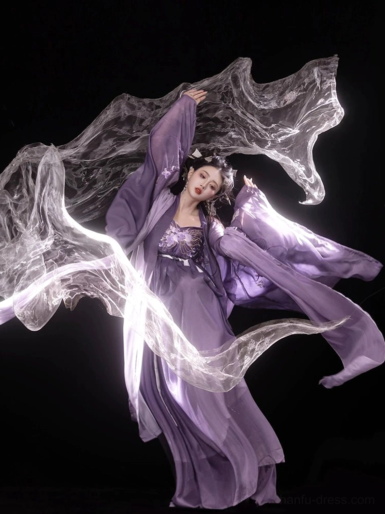 Dynamic three-quarter view of a purple Tang Dynasty Hanfu Heziqun dress with delicate chest embroidery, lightweight chiffon layers, wide sleeves, and graceful flowing movement