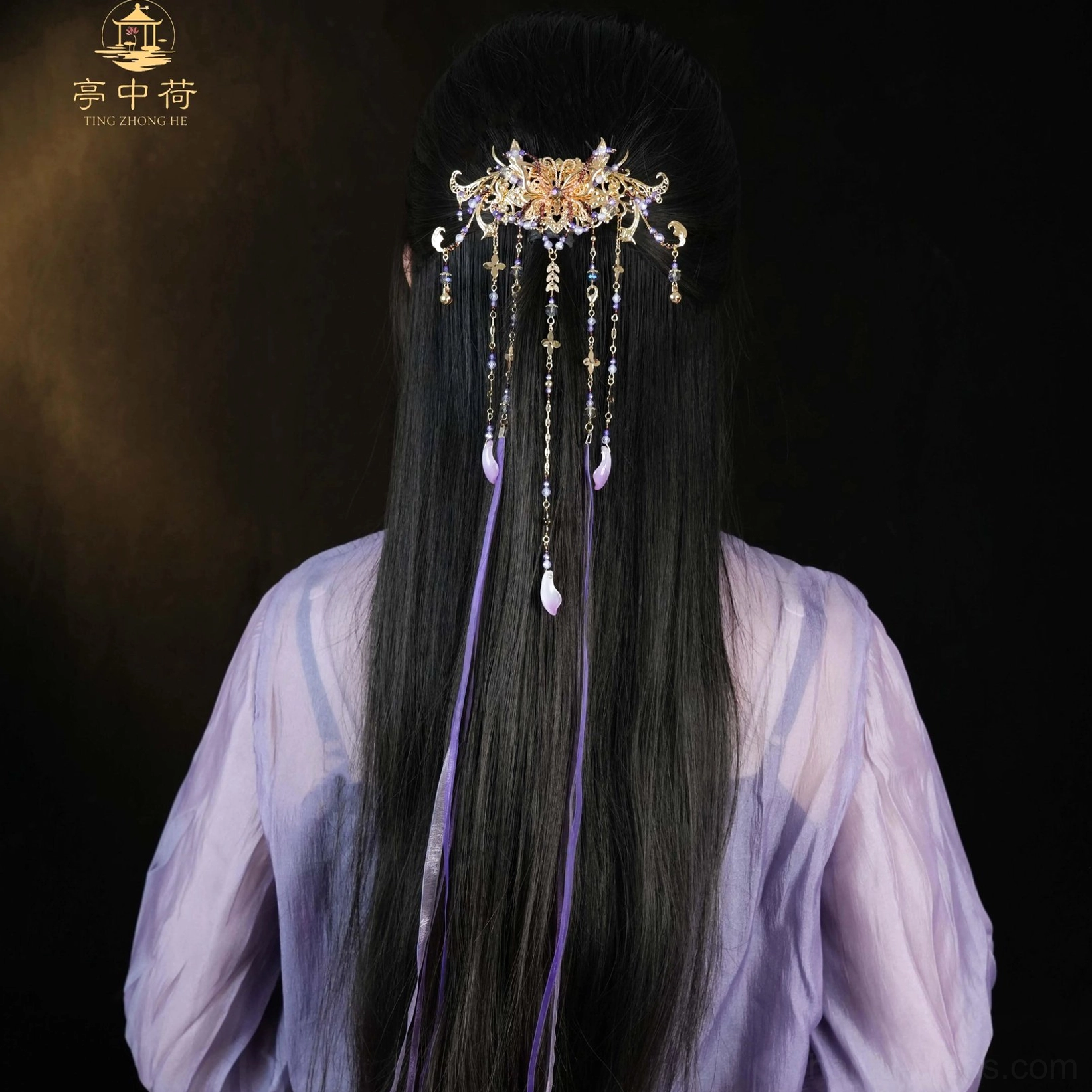Rear view of a model wearing a purple tassel Hanfu back hair pin with ornate gilt-style carved centerpiece, beaded tassels, purple silk ribbons, and teardrop pendants