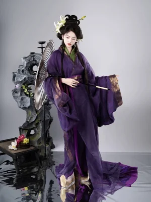 Purple Warring States and Han Dynasty Hanfu robe set shown from a three-quarter front view with sheer flowing sleeves, gold-trimmed cuffs, green inner layer, and long trailing hem