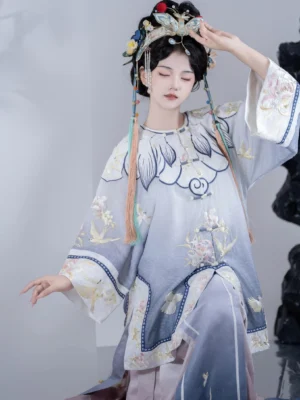 Qing Dynasty Han women’s embroidered gradient top and wrap skirt worn by model with traditional Chinese hair ornaments