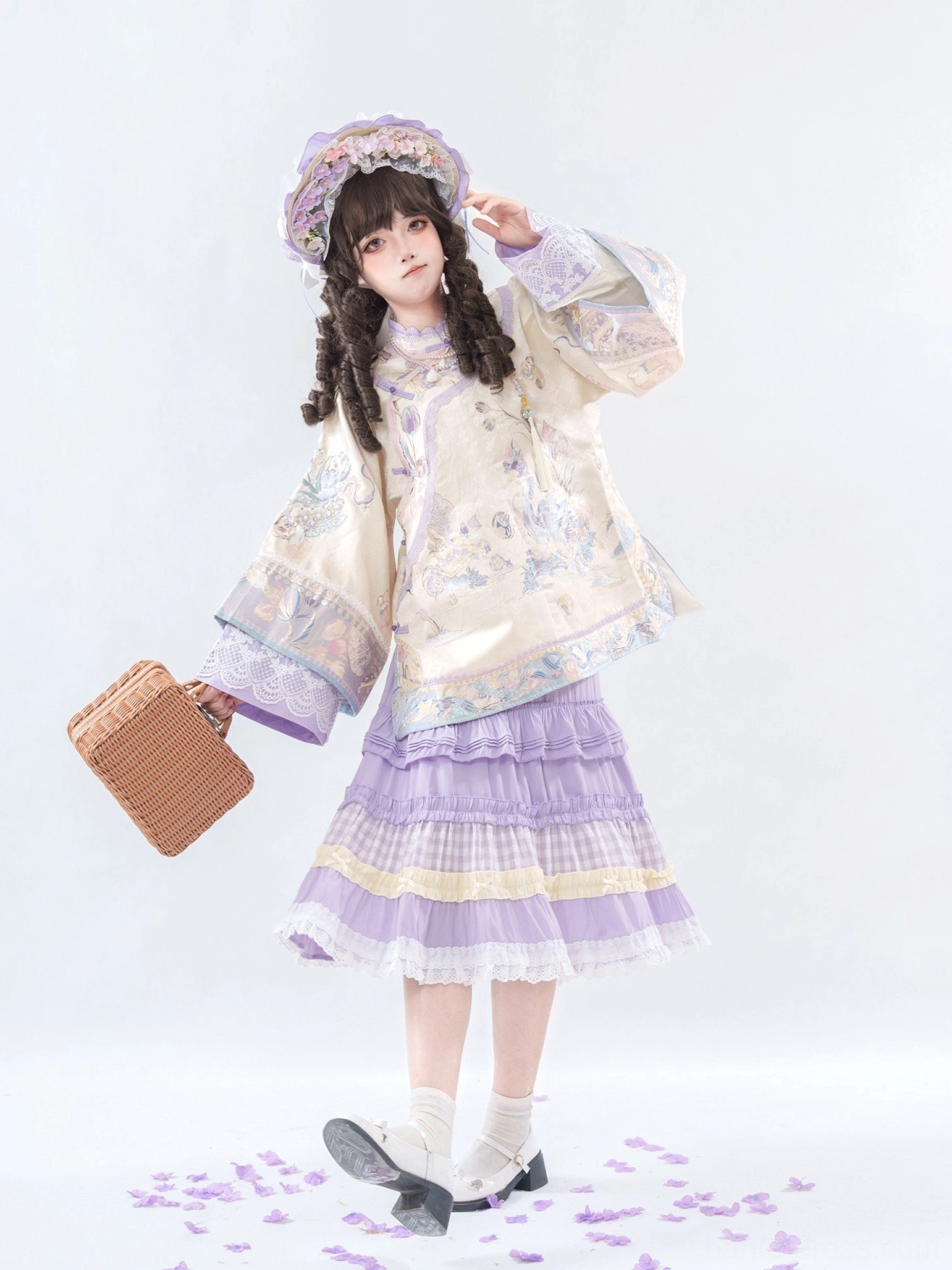 Three-quarter view of Qing-inspired Han Lolita set with beige floral embroidered top and tiered purple skirt