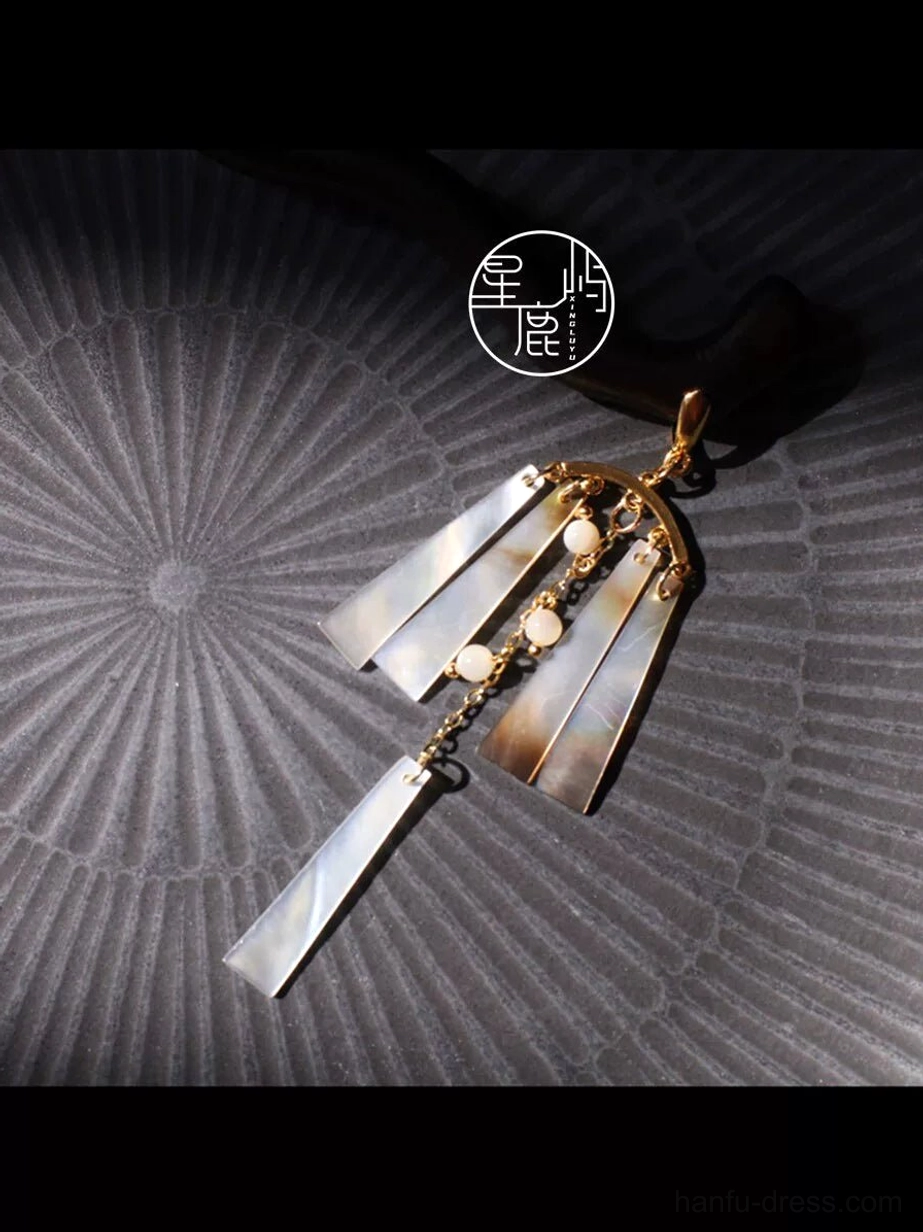 Close detail of Qingfeng vintage Chinese hair stick tassel ornament with iridescent mother-of-pearl panels, beads and long pendant