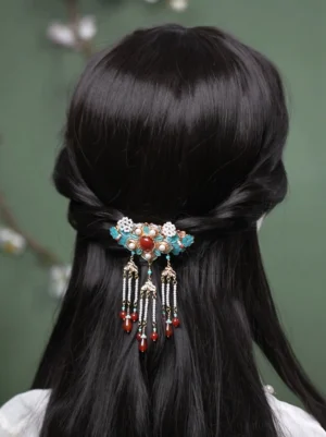 Qingping Chinese hair pin worn at the back of twisted half-up black hair, showing the traditional hanfu hair accessory in use
