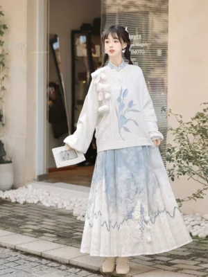 Full body view of white modern Hanfu sweater with blue floral Mamianqun horse face skirt and rabbit inspired styling