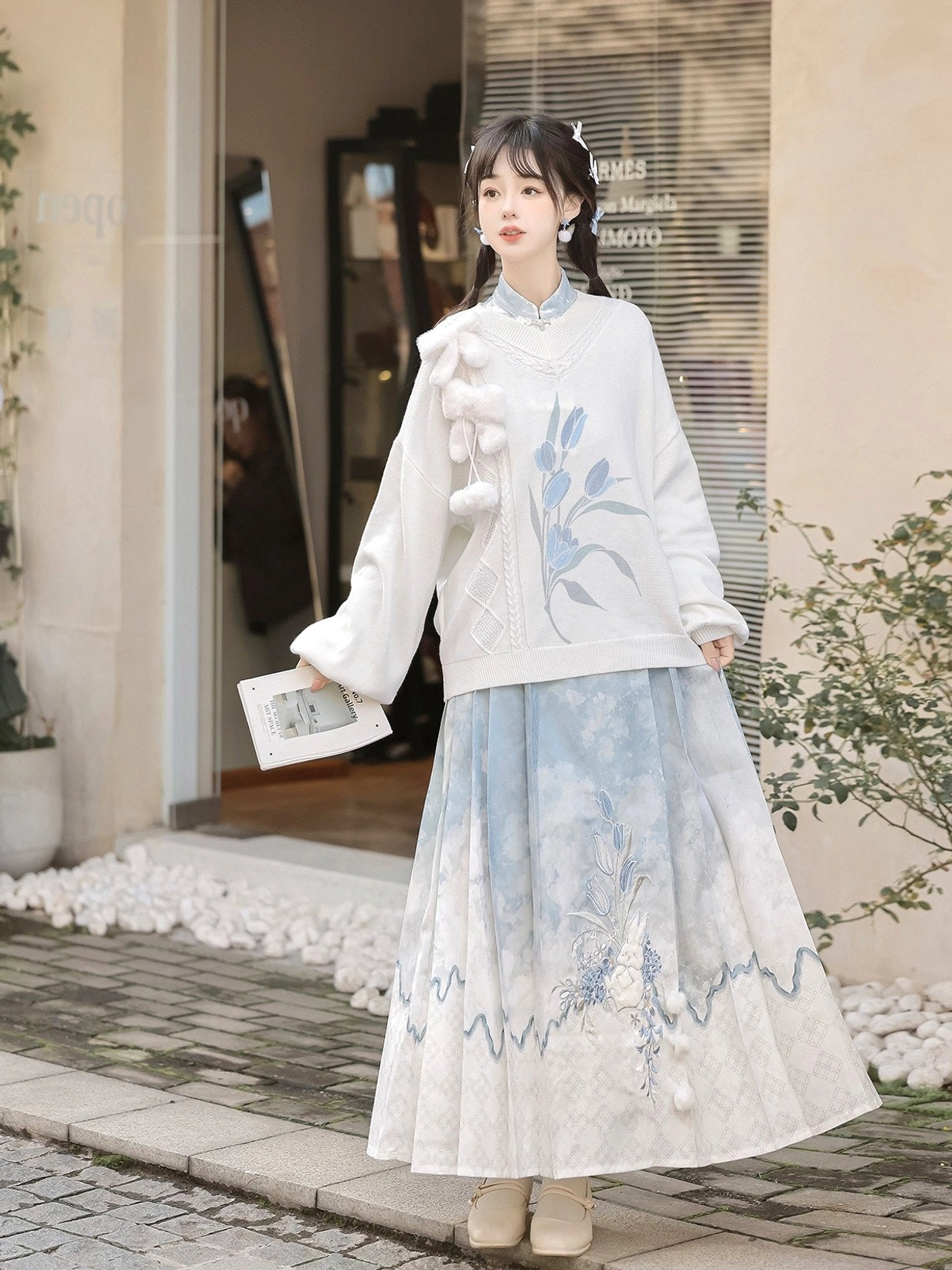 Full body view of white modern Hanfu sweater with blue floral Mamianqun horse face skirt and rabbit inspired styling
