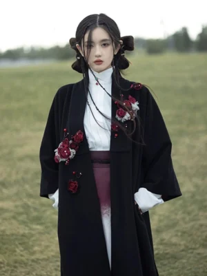 Close-up of Ragdoll Rose Ming style Hanfu jacket showing three-dimensional wine red flower appliques, stand collar, and red bead buttons