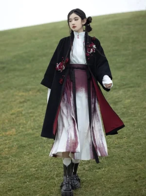 Ragdoll Rose modern Ming Dynasty Hanfu set worn outdoors with black floral jacket, white blouse, and burgundy ombre mamian skirt
