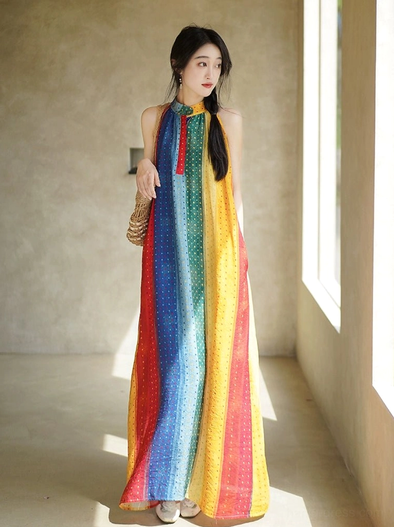 Front full-body view of a rainbow modern Chinese-style Hanfu dress featuring a stand halter collar, sleeveless design, vertical rainbow stripes, tiny polka dots, red front trim, and loose floor-length silhouette