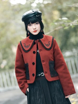 Front view of a red and black modern Hanfu cropped jacket with lucky bat embroidery on the doll collar, black lace patch pockets, round buttons, and a wool blend texture