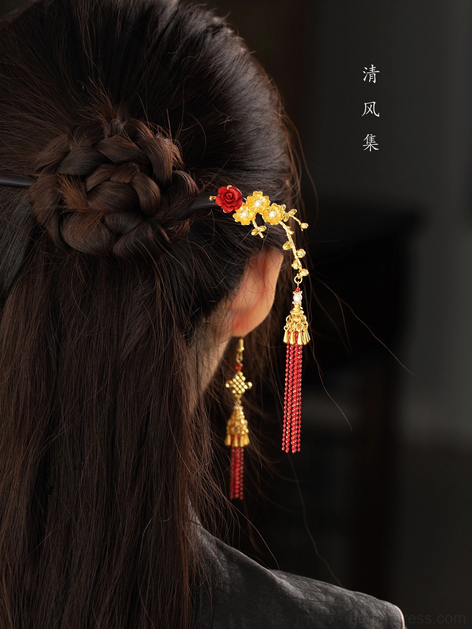 Close-up side back view of red Chinese knot tassel earring paired with floral Hanfu hairpin and braided bun