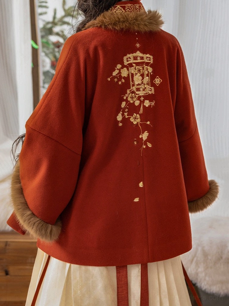 Back view of red Chinese New Year Hanfu jacket featuring golden lantern and floral embroidery with plush-trimmed cuffs