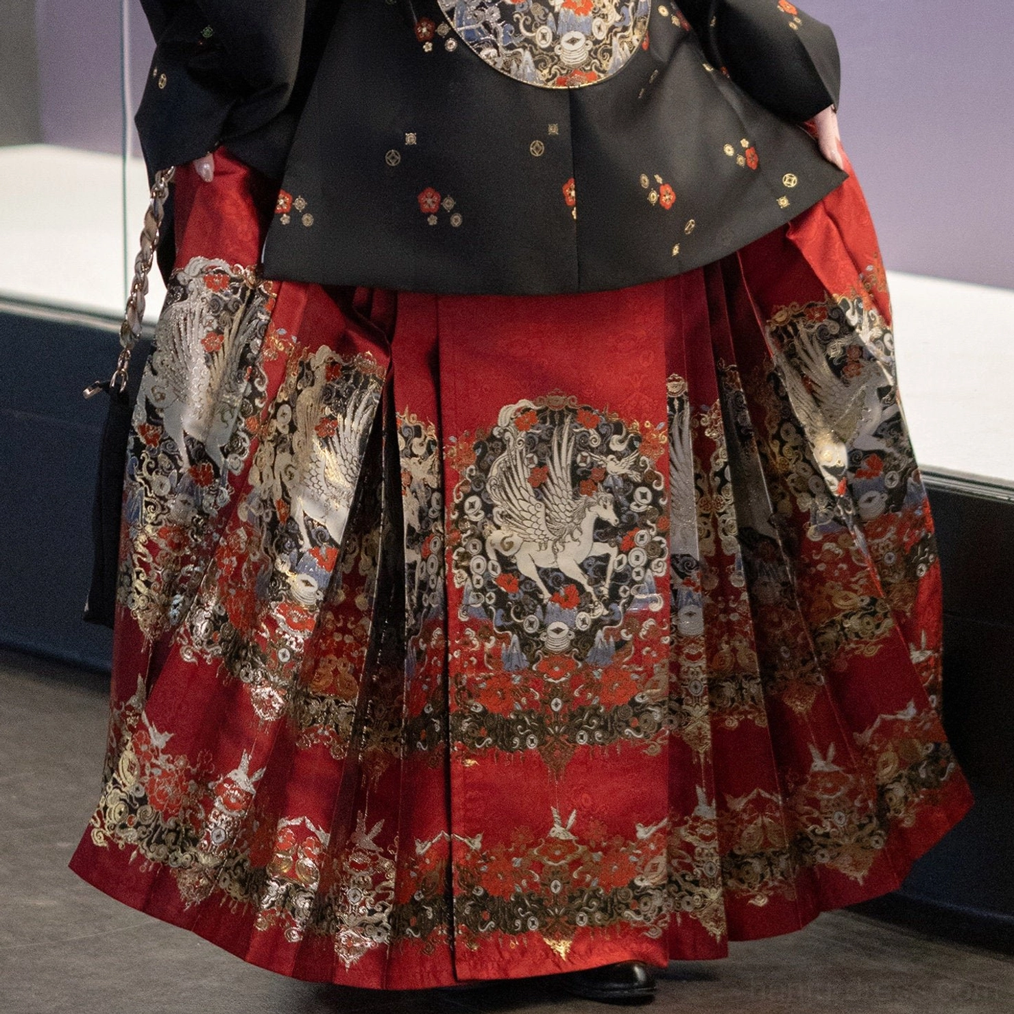 Red Chinese New Year mamian skirt with gold crane and floral embroidery close-up