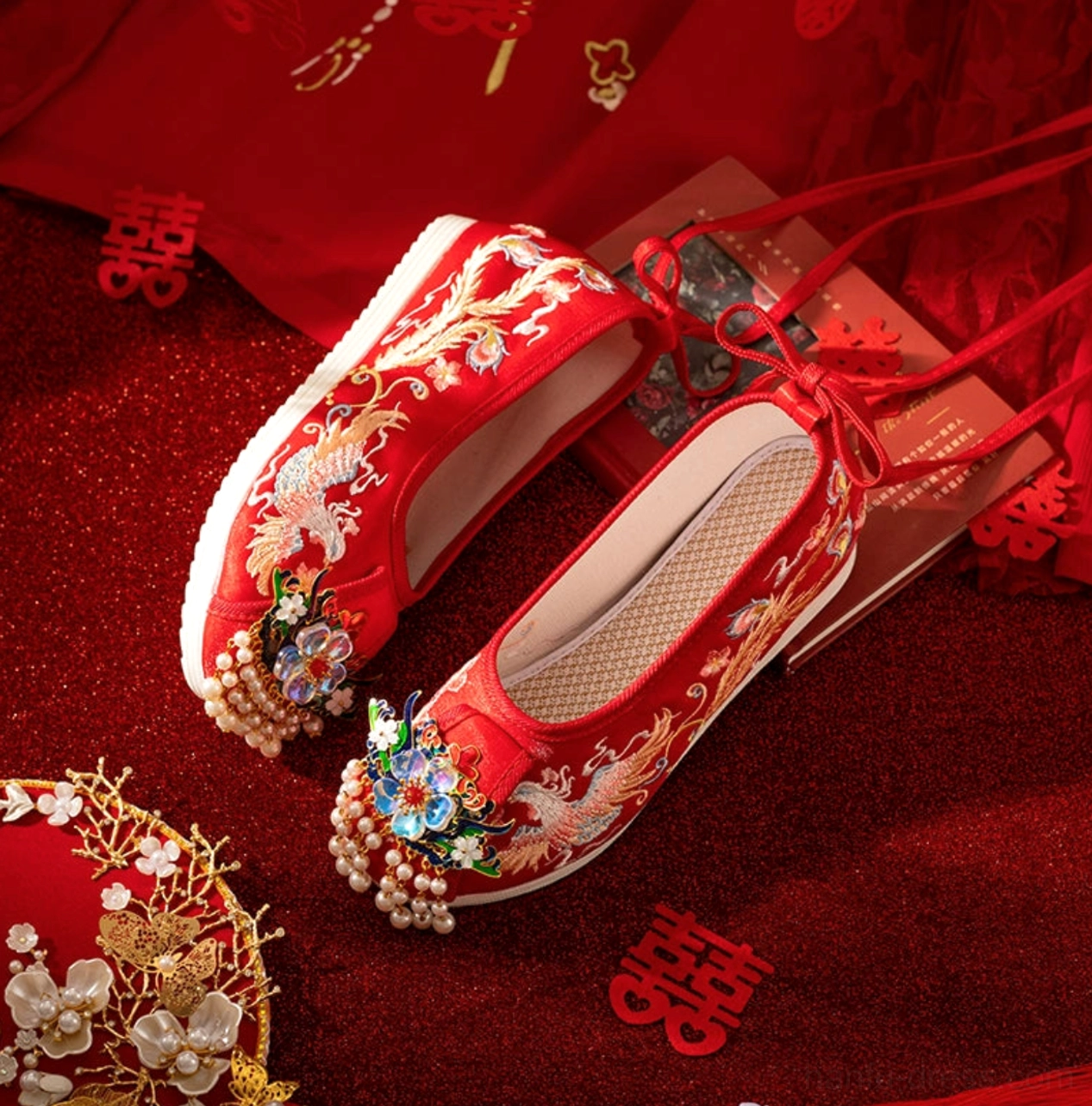 Side view of red Chinese bridal Hanfu wedding shoes showing gold dragon phoenix embroidery tassel ornaments and raised rubber platform sole