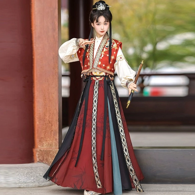 Red embroidered vest with white puff sleeve top and flowing wrap skirt styled as a Tang Dynasty hanfu swordsman outfit with short sword