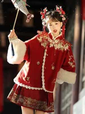 Crimson red festive modern Hanfu mamianqun horse face skirt set with embroidered coat and white trim front three quarter view