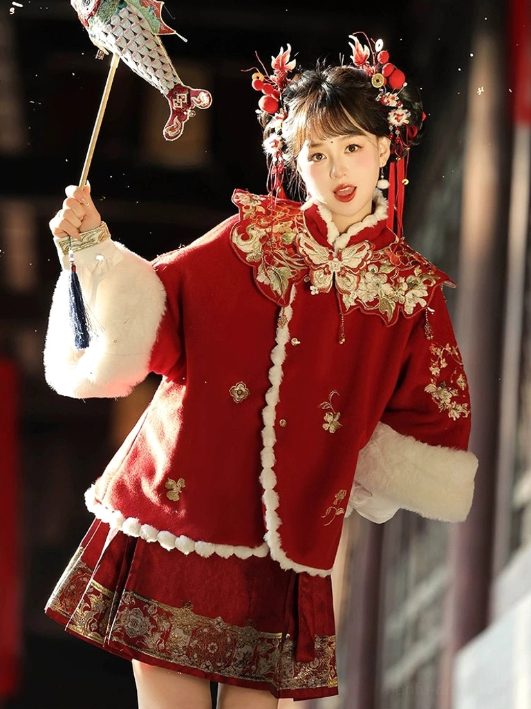 Crimson red festive modern Hanfu mamianqun horse face skirt set with embroidered coat and white trim front three quarter view